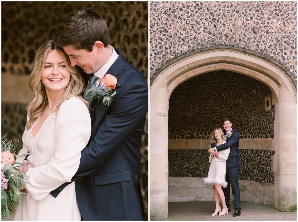 Elegant couple having a cuddle under the arch against the cobblestone wall after their Wedding at Winchester Registry Office