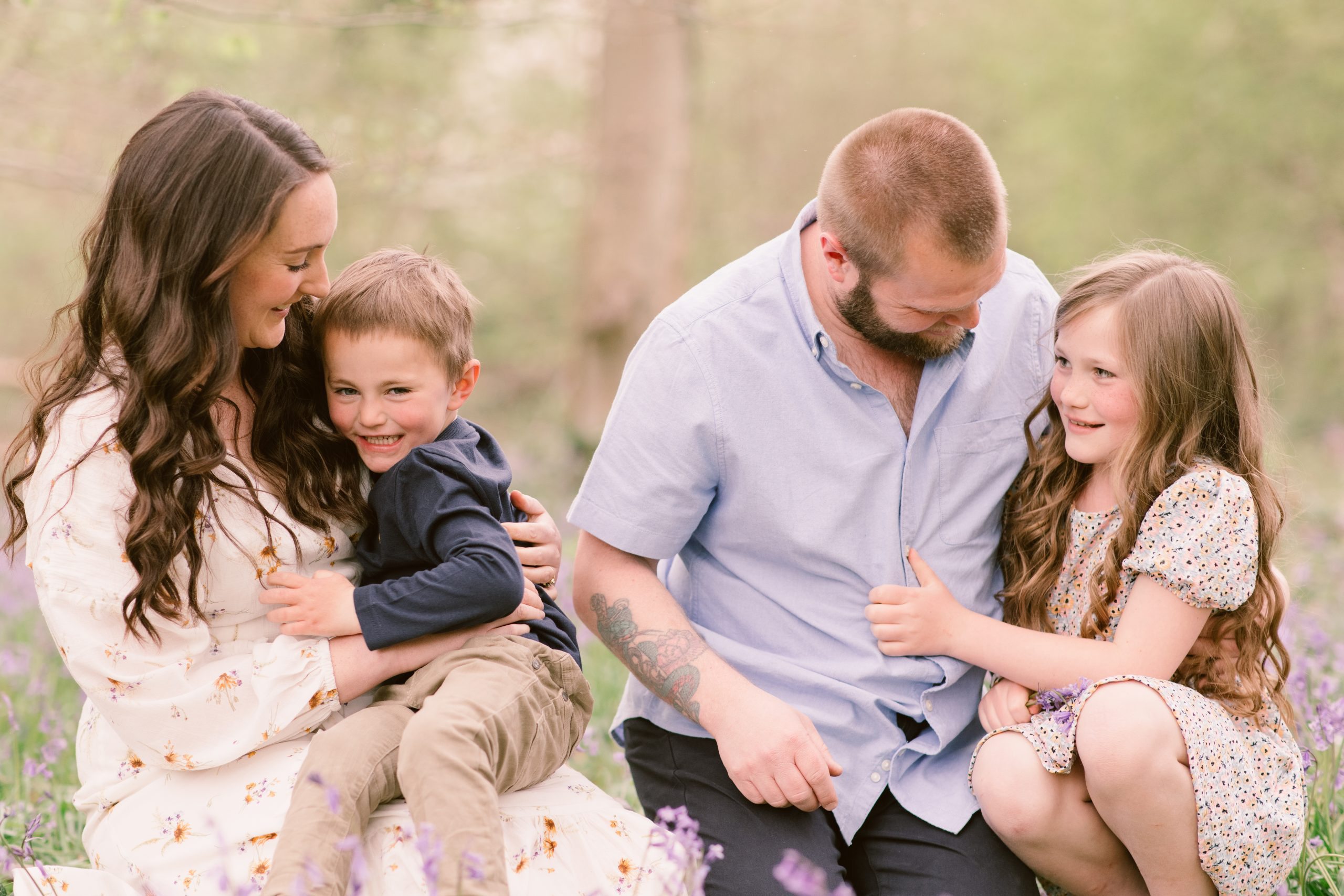 Family Bluebell Shoot Hampshire Family photography bluebell shoot of family smiling at each other