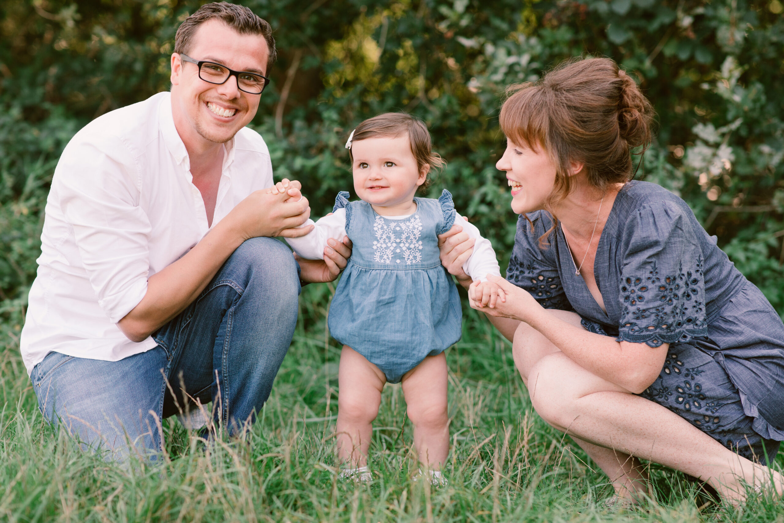 Family Photography at Warsash Common Hampshire Family photographer close up Black and white photo of Family sat on the bed looking at each other